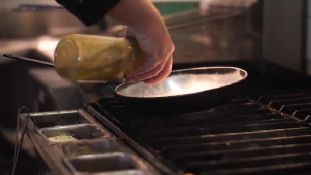 Chef Pouring Oil Frying Pan Close Shot — Vídeos de Stock