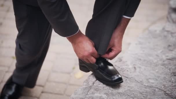 Groomsman Grey Suit Tying His Shoe — Stock Video