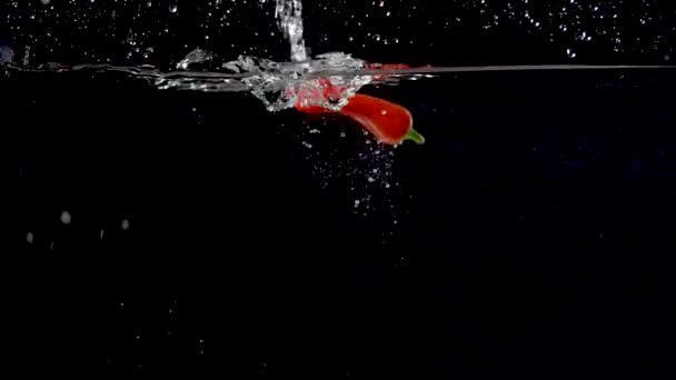 Vibrant Red Sweet Pepper Being Dropped Water Slow Motion — Stockvideo