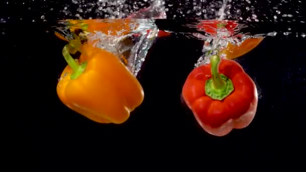 Beautiful Bell Peppers Being Dropped Water Slow Motion — Vídeo de Stock