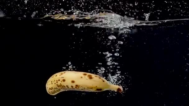 Ripe Banana Being Dropped Water Slow Motion — Stok video