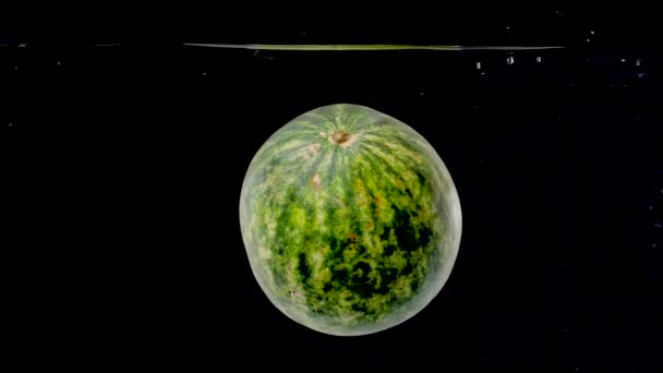 Colorful Watermelon Being Dropped Water Slow Motion — Wideo stockowe
