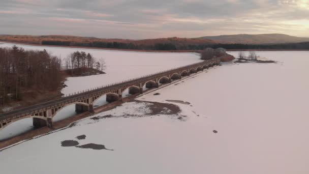 Aerial Flight Architectural Bridge Frozen Lake Colorful Sunset Light — Stockvideo