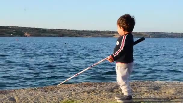 Cute Boy Toddler Learning How Use Fishing Rod Rocky Shoreline — Video