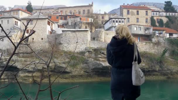 Back View Blonde Woman Blue Winter Coat Staring Neretva River — Stok Video