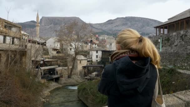 Back View Clip Blonde Woman Looking Sights Old Town Mostar — стоковое видео