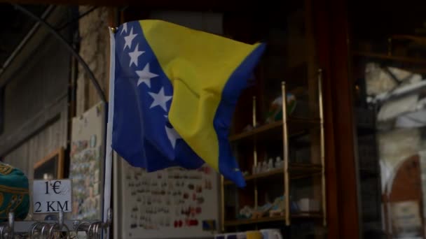 Small Flag Bosnia Herzegovina Fluttering Wind Shop Mostar — Stockvideo