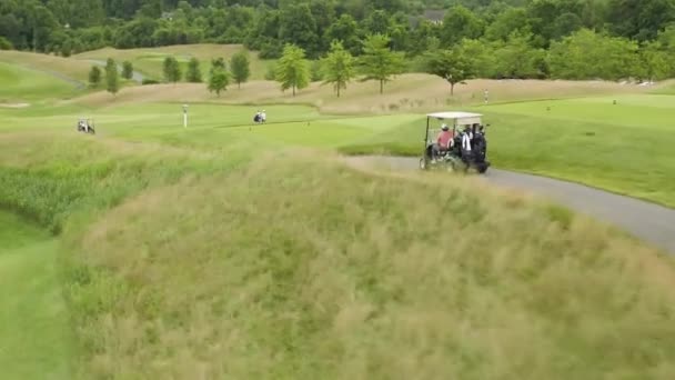 Street Level View Golfers Caddies Golf Carts — 图库视频影像