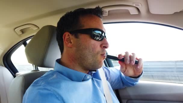 Inhaling Iqos Smoke While Driving — ストック動画