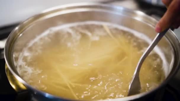 Chef Stirring Spaghetti Boiling Pot Slow Motion — Wideo stockowe