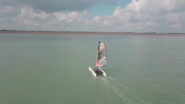 Man Sailing His Catamaran Sea Drone Pans Side Beautiful Coastal — Video Stock