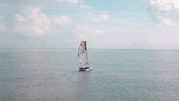 Man Sailing His Catamaran Sea Drone Flyover Looking Beautiful Coastal — Vídeo de Stock