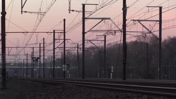 Train Tracks Catenary Sunset Passing Cars Distant Bridge Creating Feeling — 图库视频影像