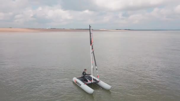 Man Sailing His Catamaran Sea Drone Circles Boat Beautiful Coastal — Stock video