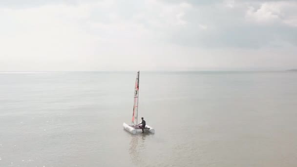 Man Sailing His Catamaran Sea Drone Circles Boat Full 360 — Stockvideo