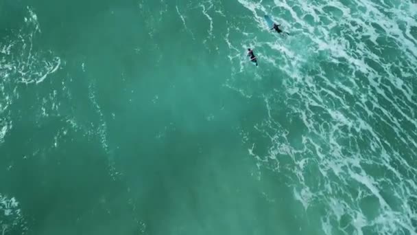 Drone Shot Two Surfers Paddling Together Waves — Vídeo de Stock