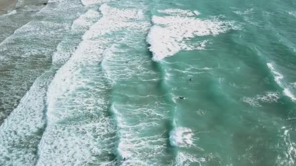 Surfers Swimming Out Breaking Waves Wide Drone Shot — Video Stock