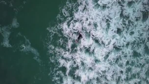 Birds Eye View Surfer Duck Diving Choppy Waves Drone Shot — Stock video