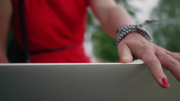 Detail Shot Woman Hand Red Nails Opening Laptop Park Defocused — стоковое видео