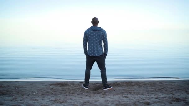 Man Staring Out Beautiful Lake Sunset — Stock video