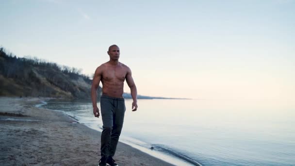 Muscular Male Model Walking Slow Motion Beach — Stock video