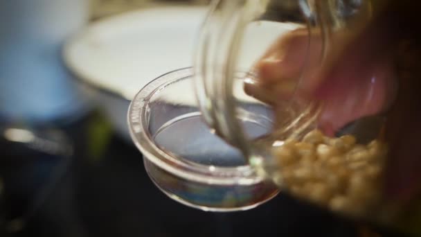 Pouring Popcorn Kernels Cup Slow Motion — Stock video