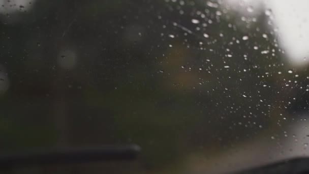 Closeup Wet Rain Hitting Windshield Being Cleaned Window Wipers Slow — 图库视频影像