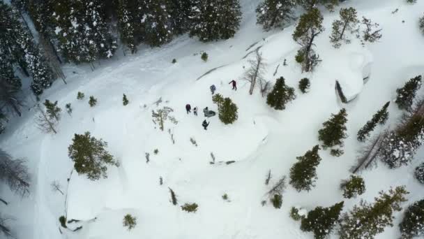 Aerial Orbiting Shot Group People Snowy Mountain — Video