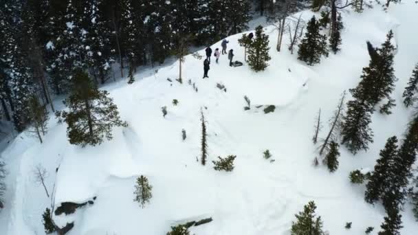 Aerial Backward Pan Shot Group People Snowy Mountain — Stockvideo