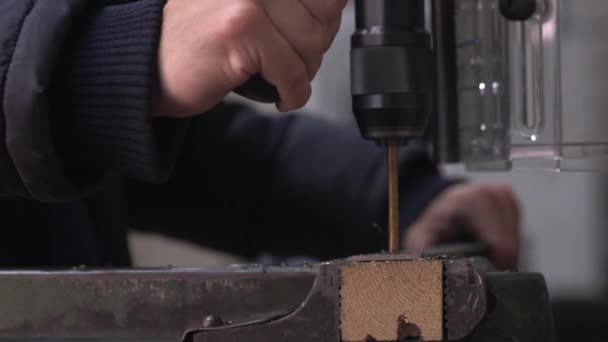 Close Shot Man Operating Drilling Machine Drilling Multiple Holes Golden — Video