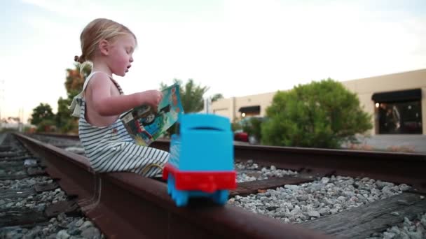 Young Child Has Great Time Reading Book His Train Train — Video