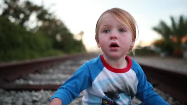 Young Child Has Great Time Playing Train Tracks Pretending Engineer — Stockvideo