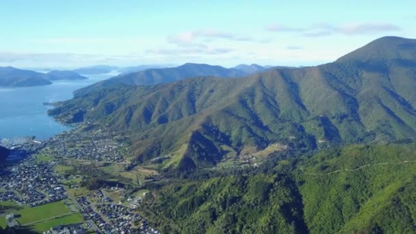 Aerial Drone Shot Sea Town Panning Mountainous Forest New Zealand — Stockvideo