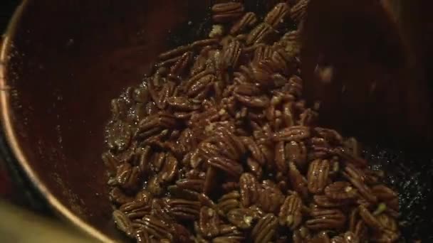Close Slow Motion Shot Roasted Caramelised Pecan Nuts Being Stirred — 图库视频影像