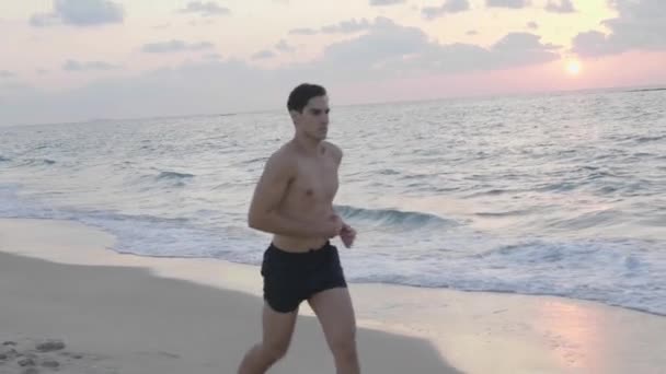 Athletic Young Runner Jogging Alone Beach Evening — Stockvideo