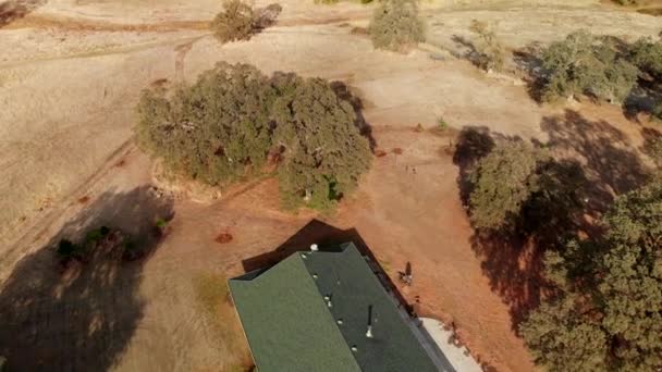 Aerial Drone Shot Pans Rural Farm Land House — Wideo stockowe