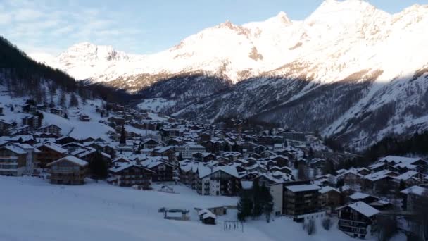 Flying Small Snow Covered Town Mountains — Video