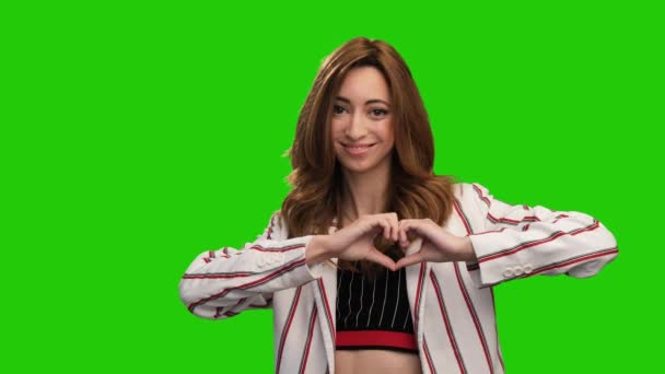 Pretty Young Woman Poses Green Screen Showing Heart Gesture Blowing — Stok Video