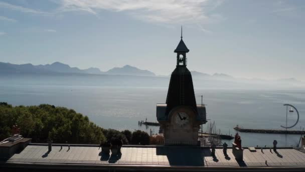 Aerial Dolly Clock Tower Overlooking Lake Geneva Switzerland — Stockvideo