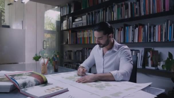 Man Working Blueprints Looking Camera Latin American Architect Working — Vídeo de stock