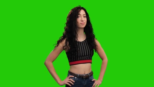 Confident Woman Long Curly Hair Crosses Hands Posing Green Screen — Stock videók