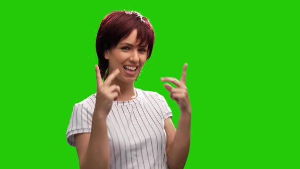 Portrait Happy Woman Showing Victory Sign Green Background — Stock videók