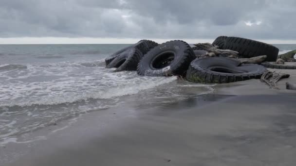 Giant Tires Beach Orbit Shot — Stok video
