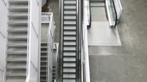 Top View Stairwell Escalator Going Handheld — Vídeos de Stock