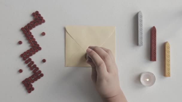 Wax Sealing Letter Using Wooden Classic Seal Top View — Vídeo de stock