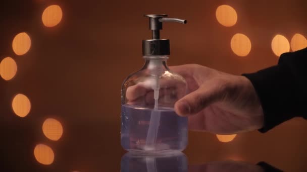 Hand Model Setting Transparent Soap Dispenser Beautiful Bokeh Backdrop — Vídeo de stock