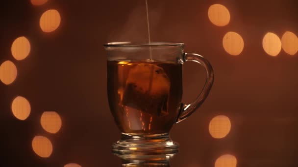 Black Tea Back Being Dunked Throughout Steaming Glass Mug Beautiful — Vídeo de Stock