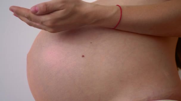 Pregnant Woman Putting Creme Belly — Stock Video