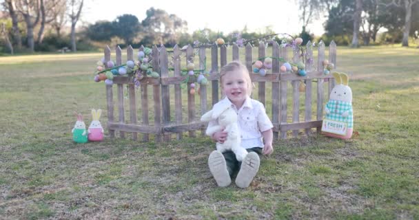 Young Boy Dressed Easter Smiles Holds His Stuffed Easter Bunny — Wideo stockowe
