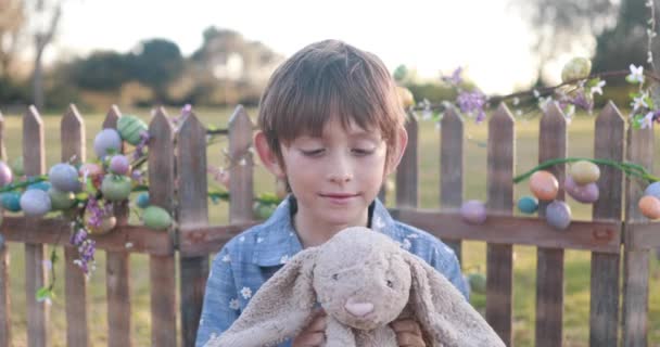 Close Shot Boy Dressed Easter Attire Playing Stuffed Easter Bunny — Video Stock